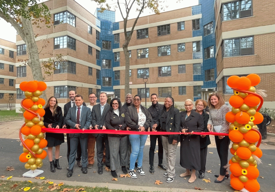 city and partners cutting the ribbon at Williamsburg Houses 